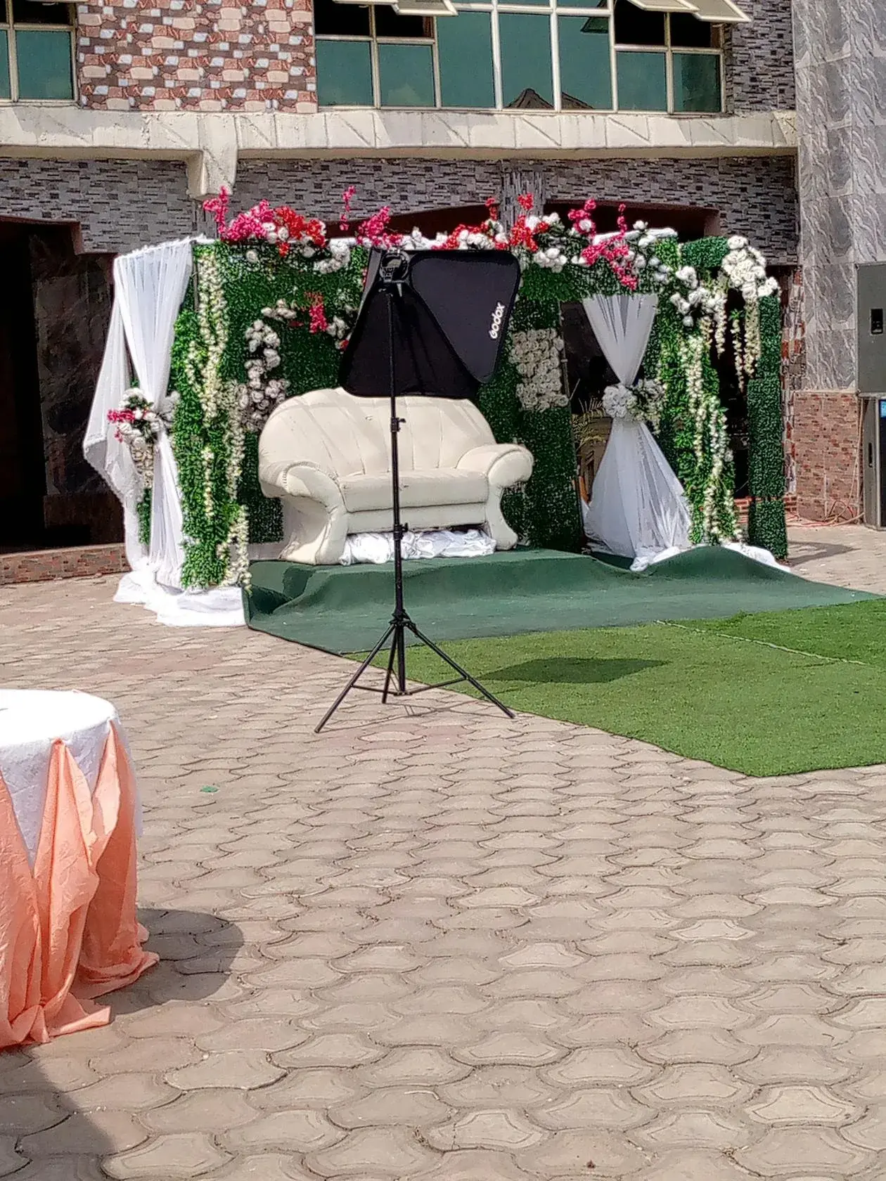 A beautiful floral arch at an outdoor summer wedding ceremony